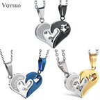 Close‑up of puzzle heart couple necklaces on white background