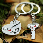 Close-up of matching heart keyrings for couples showing red and silver metal finish, perfect anniversary present.