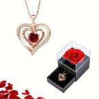 Red zircon heart necklace elegantly positioned on white background with rose box – gift idea.