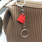 Heart keychain pair with metallic finish detail
