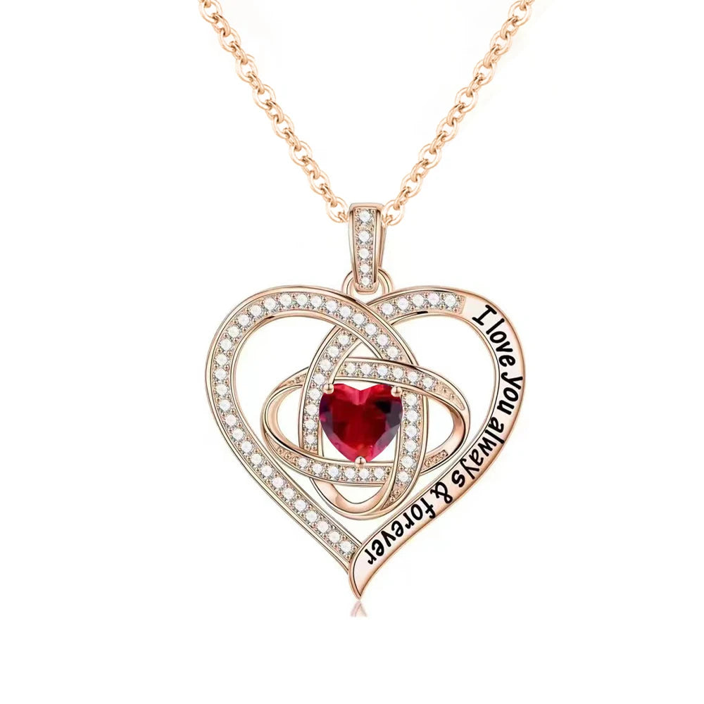 Open rose box displaying red zircon heart pendant necklace – luxury romantic gift.