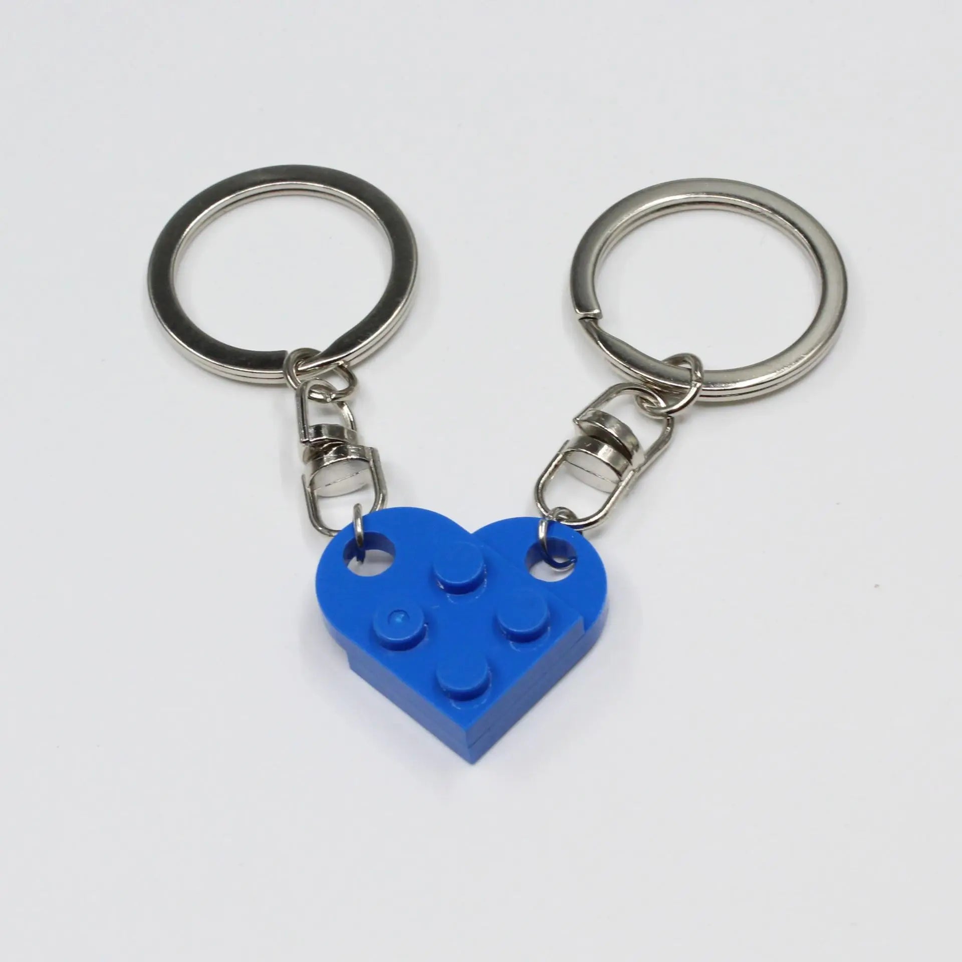 Pair of heart keychains displayed with gift box