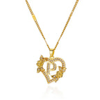 Gold heart initial necklace minimalist composition