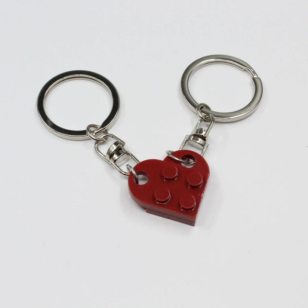 Heart couple keychains against romantic background