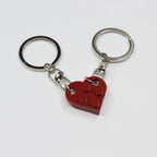 Heart couple keychains against romantic background