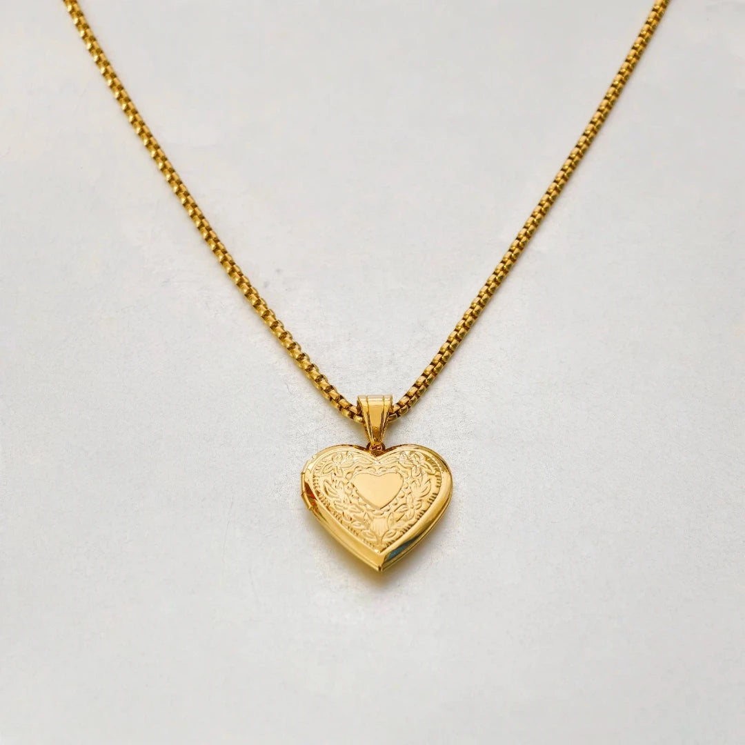 Gold heart locket with delicate chain display