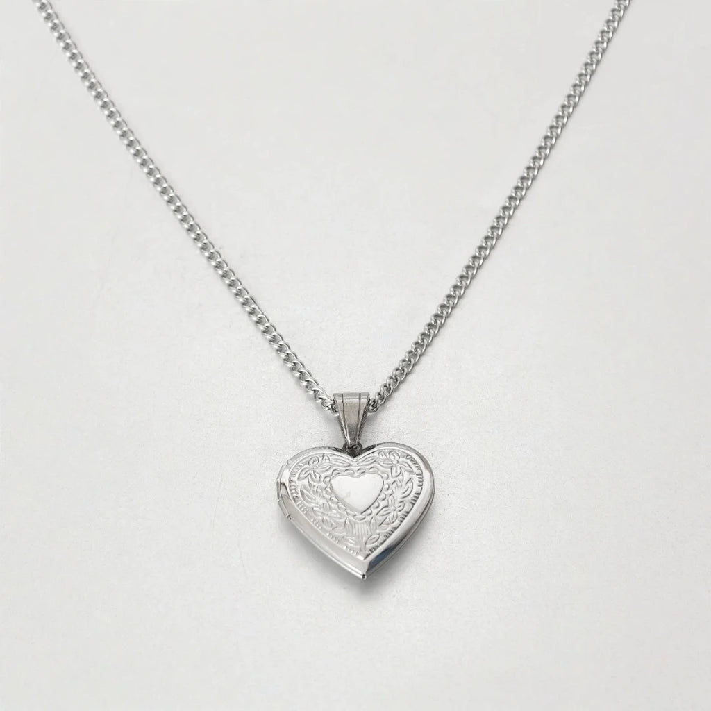 Necklace packaging with heart locket visible