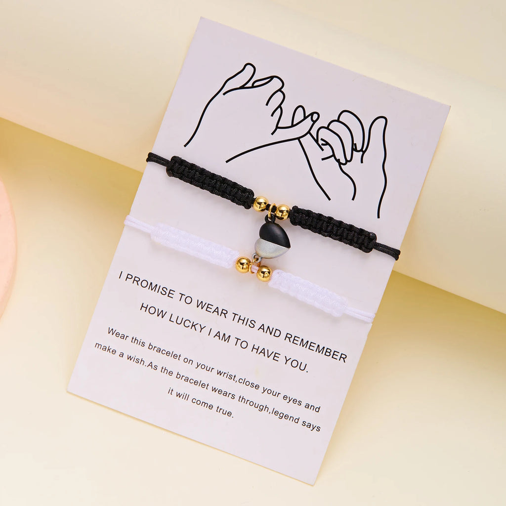 Close shot of heart magnet connecting two bracelets