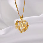 Personalized heart initial necklace on white background