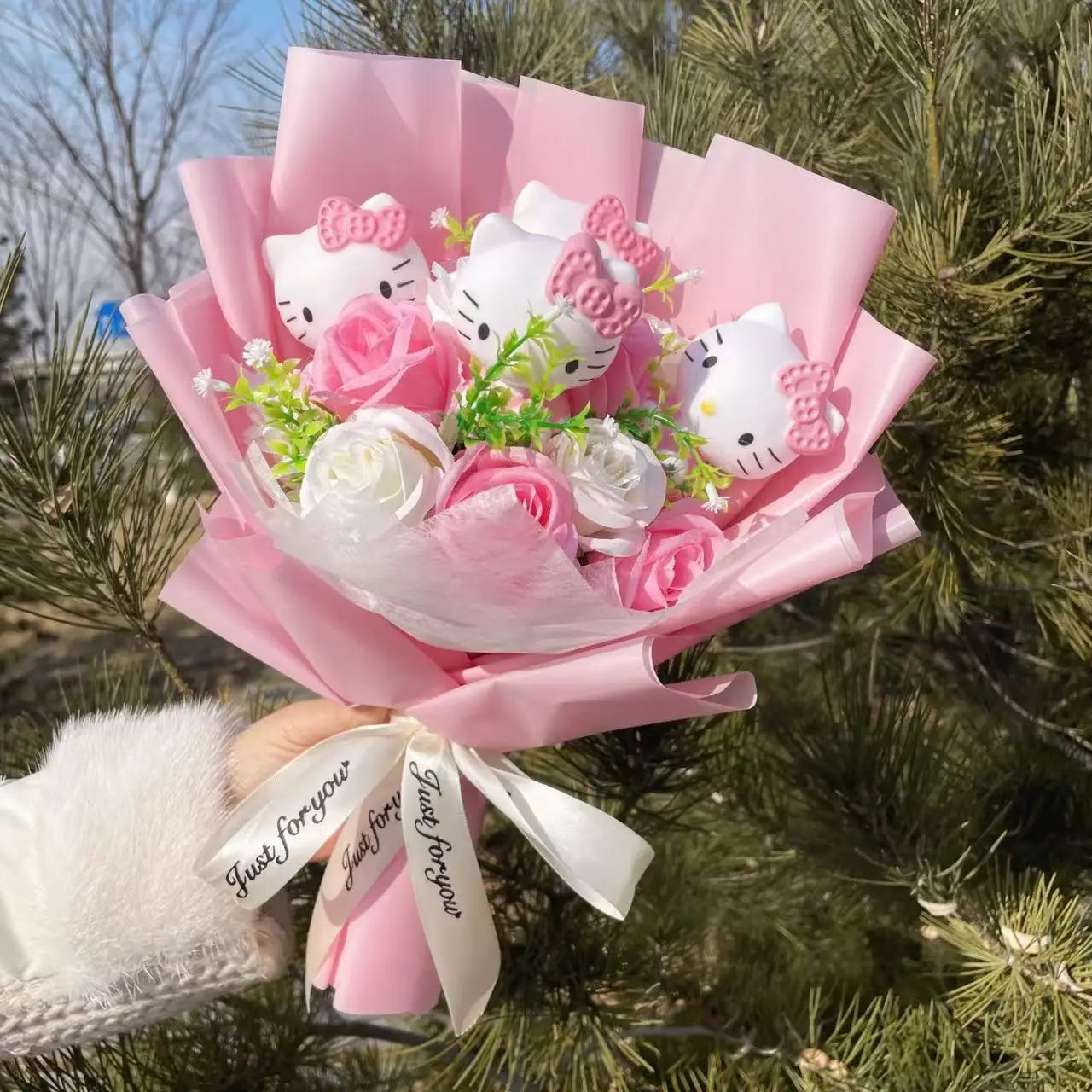 Overhead shot of Hello Kitty plush and flowers