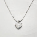 Heart necklace detail with shiny finish