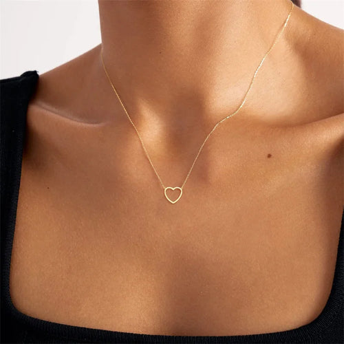 Geometric heart pendant necklace photographed with soft lighting